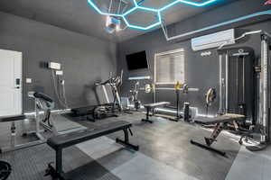 Exercise room with a wall mounted AC