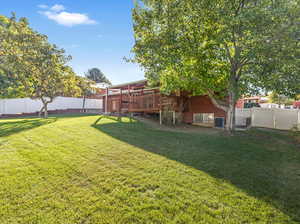 View of yard with a deck