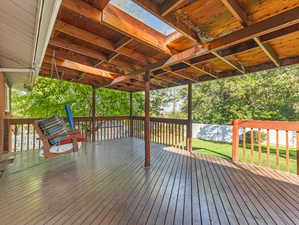 Wooden terrace with a lawn