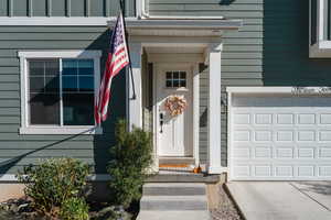 Property entrance with a garage