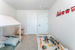 View of carpeted bedroom