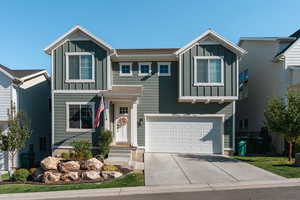 View of front facade featuring a garage