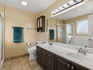 Full master bathroom with separate bathtub and shower