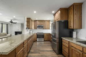 Kitchen featuring granite counters, stainless steel appliances, large area to gather around the kitchen counter and enjoy cooking together.