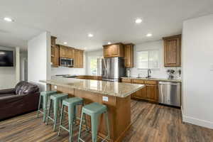 Great open  kitchen with an amazing peninsula, appliances with stainless steel finishes and granite countertops.