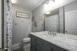 Updated hall bathroom with updated tile and new cabinet and countertops.