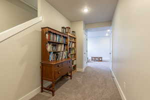 Hall with light colored carpet