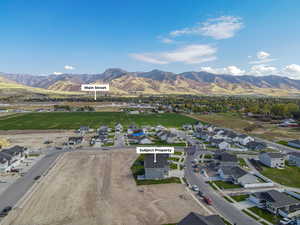 Birds eye view of property featuring a mountain view