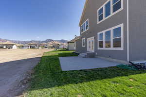 View of yard with a mountain view and a patio