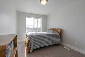 View of carpeted bedroom