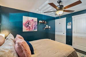 Bedroom featuring a textured ceiling and ceiling fan