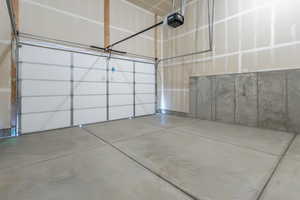 Garage featuring a garage door opener