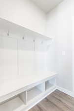 Mudroom featuring wood-type flooring