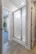 Bathroom with a shower with shower door