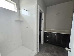 Bathroom with vanity and walk in shower