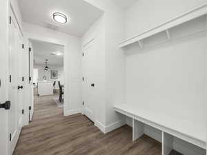 Mudroom with hardwood / wood-style flooring