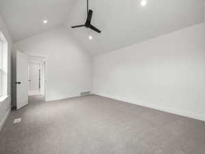 Master Bedroom with high vaulted ceiling featuring ceiling fan, and carpet floors