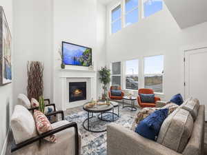 Great room featuring a high ceiling and hardwood / wood-style flooring