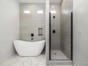 Master Bathroom featuring plus walk in shower