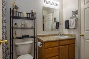 Bathroom with vanity and toilet