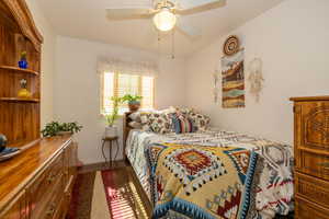 Bedroom with  wood floor ceiling fan