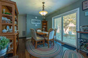 Dining area with dark hardwood / wood floors