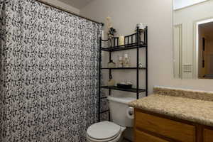 Bathroom with toilet and vanity