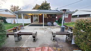 Rear view of property featuring a patio area