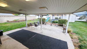 View of patio / terrace with a shed and a playground