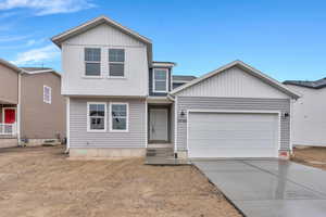 View of front of property featuring a garage