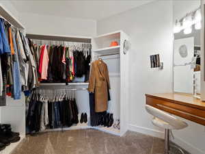 Master Walk in closet with carpet flooring