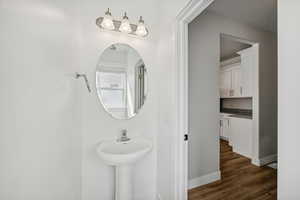 Bathroom with hardwood / wood-style floors