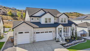 View of front facade featuring a garage