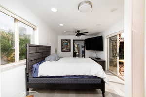 Bedroom featuring light hardwood / wood-style floors, access to outside, and ceiling fan