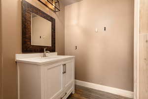 Bathroom featuring vanity and hardwood / wood-style flooring