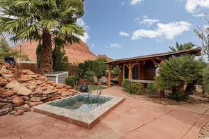 Exterior space featuring a patio, a mountain view, a small plunge pool.