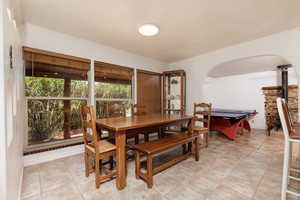 Dining room featuring light tile patterned floors