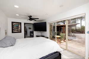 Bedroom with access to outside, light wood-type flooring, and ceiling fan