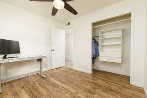 Interior space featuring ceiling fan and wood-type flooring