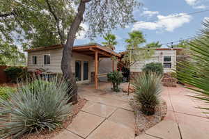 Rear view of house with a patio area