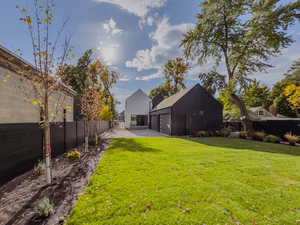 View of yard with a garage