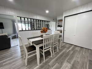 Dining area with wood-type flooring