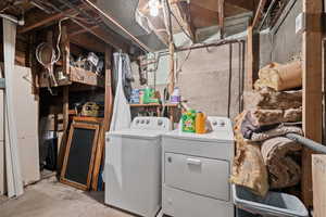 Washroom with washing machine and clothes dryer