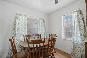 Dining area with wood-type flooring