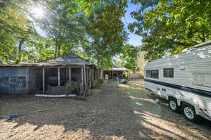 View of yard with a sunroom