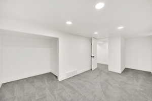 Basement with light carpet