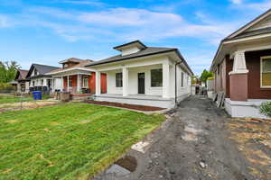 View of front of house featuring a porch and a front lawn