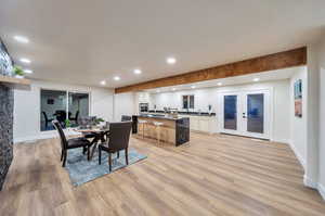 Dining space featuring french doors and light hardwood / wood-style floors