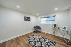 Sitting room featuring hardwood / wood-style floors