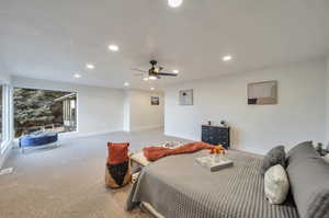 Bedroom featuring ceiling fan and carpet floors